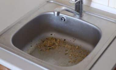 This Everyday Kitchen Essential Will Keep Your Black Sink Limescale-Free